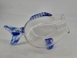 blue and white glass fish figurine on a white background