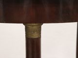 a close up of a wooden table with a metal handle on it