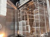 an image of a dishwasher inside of a stainless steel oven