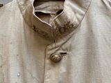 an image of a jacket with buttons on a hanger