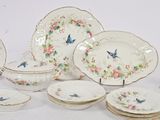 many plates and bowls that are sitting on a table