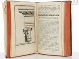 an open book with a drawing of a column on it