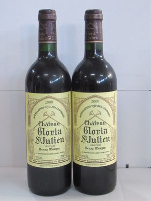 two bottles of wine sitting on top of a counter next to each other