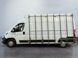 a picture of a white delivery truck parked in a parking lot