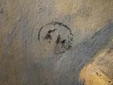 a painting of a face on the side of a wall