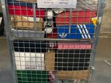 a metal cart with a lot of boxes on top of it