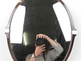 a man taking a picture of himself in a mirror