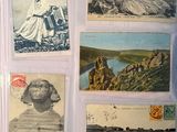 several old postcards with pictures of people on them on a table