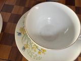 a tea pot and a tea cup on a table