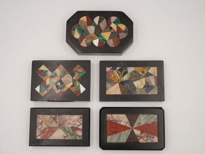 four pieces of art are hanging on a wall next to each other