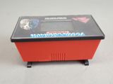 a red box with a game on it on a table