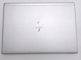 a white laptop that is sitting on a table