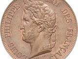 a close up of a coin with a woman ' s head on it