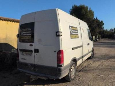 a white van that is parked in the dirt