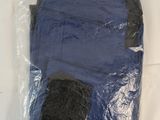 a plastic bag with a blue shirt inside of it