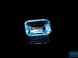 a blue topazte gems on a black background