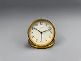 a small clock that is sitting on a table