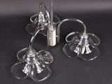 a pair of glass candle holders on a black table