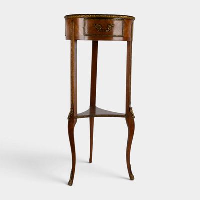 a small wooden table with a drawer on top of it