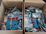 two boxes filled with lots of different items in them