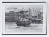 a black and white photo of a boat in the water