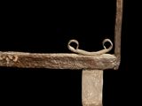 a close up of a metal object on a black background