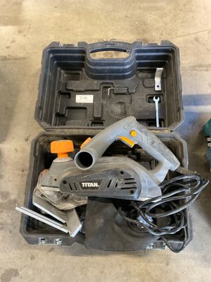 two tools that are sitting on the floor next to each other