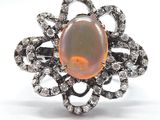 une bague en oplite et diamants, ornée d'un motif floral au centre