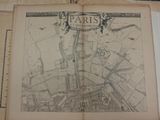 an old map of paris on a piece of paper on a table