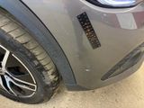 a close up of a car ' s tire with a sticker on it