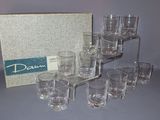 a lot of glasses that are sitting on a table
