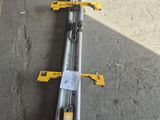 a close up of a couple of tools laying on top of a cement floor