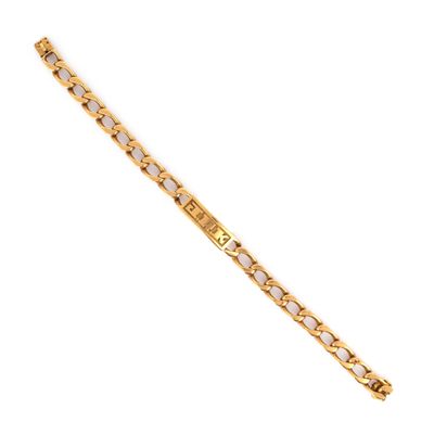 un bracelet doré et blanc muni d'un fermoir en diamant