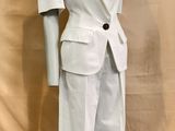 an image of a mannequin dressed in a white suit
