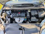 the engine of a car with its hood open and the hood open