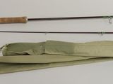 two fishing rods and a bag on the table