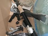 a box full of assorted items including a gun, knife, and other items