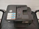 a printer that is sitting on top of a chair