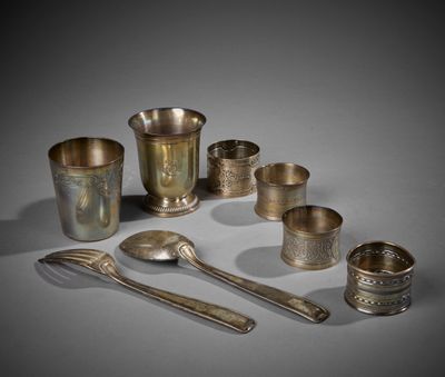an assortment of silverware including spoons, cups, and spoons