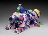 ceramic figurine of a dog with a crown on its head