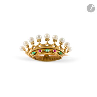 a close up of a gold ring with pearls and emeralds