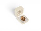 a small white box with a coin inside of it