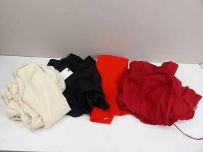 a pile of clothes sitting on a white table
