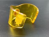 yellow acrylic ring with a square cut in the middle