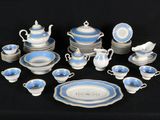 a picture of a blue and white dinner set on a black table