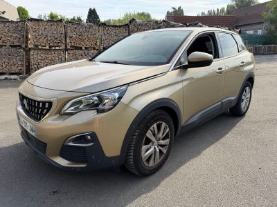 a beige car parked in a parking lot