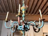 a chandelier that is hanging from the ceiling