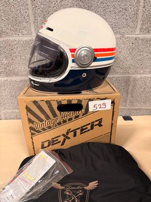 a helmet and a t - shirt sitting on a table