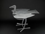 an image of a glass bird sitting on top of a metal stand