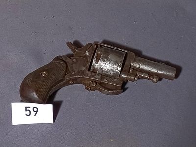 an old gun with a tag on it